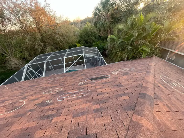 Roof inspection with every damaged spot chalk-marked