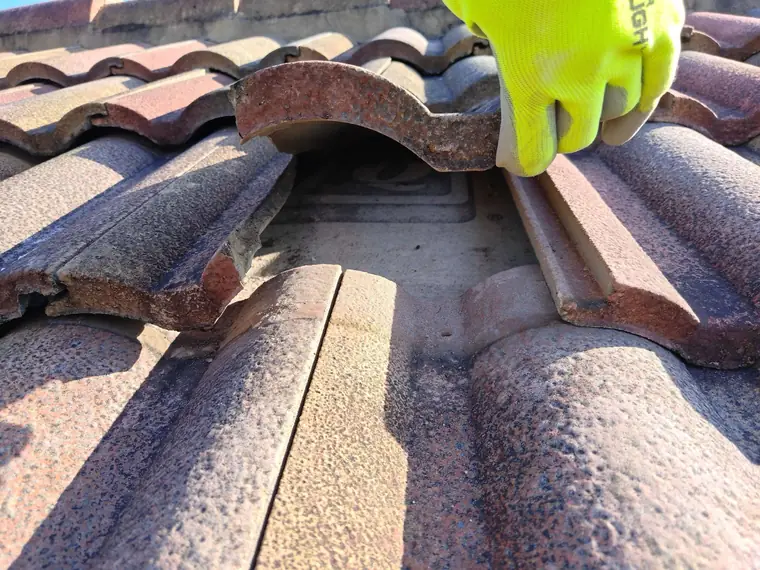 Broken tile and the exposed area underneath